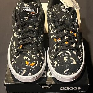 Adidas black sneakers with tan butterflies